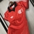 Camisa feminina do Flamengo, modelo Lifestyler da Adidas, na cor vermelha, com detalhes em preto e o logo do clube.CAMISA FLAMENGO LIFESTYLER ADIDAS 2024 FEMININA