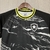 Camisa feminina do Botafogo, preta com detalhes em amarelo, com design moderno e logo do time.