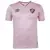 Camisa rosa do Fluminense, modelo 2024, fabricada pela Umbro, com logo e detalhes em marrom.