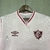 Camisa rosa do Fluminense, modelo 2024, fabricada pela Umbro, com logo e detalhes em marrom.