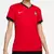 Camisa feminina vermelha da seleção de Portugal, modelo 2024/25, com detalhes em verde e logo da Nike.