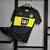 Camisa preta e amarela do Borussia Dortmund II, modelo away 24/25 da Puma, com logotipo do time e patrocínio em destaque.