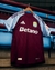 Camisa do Aston Villa Home 24/25 da Adidas, com detalhes em azul e vermelho, exibindo o logo do time e da marca.