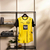 Camisa do Borussia Dortmund I Home 24/25 da Puma, predominantemente amarela com detalhes em preto e listras verticais.