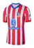 Camisa do Atlético de Madrid 2024/25, modelo home, nas cores branca, vermelha e azul, com detalhes em listras.