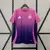 Camisa de futebol masculina da seleção alemã, modelo away 2024/25, na cor rosa com detalhes em roxo e logo da Adidas.