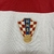 Camisa branca e vermelha da seleção da Croácia, modelo 2024/25, com logo da Nike e escudo da seleção. CAMISA MODRIC