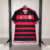 Camisa do Flamengo I Home 24/25 masculina da Adidas, com listras rubro-negras e escudo da equipe.