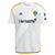 Camisa branca do LA Galaxy 2024/25, com detalhes em amarelo e logotipo da Herbalife.