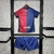 Kit infantil do Barcelona para a temporada 24/25, composto por camiseta grená e azul com logo da Nike e calções combinando.