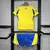 Kit infantil do Al-Nassr, composto por camisa amarela com detalhes azuis e shorts azuisKit Infantil Al-Nassr I Adidas - Home time do Cristiano Ronaldo