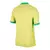 Camisa amarela da seleção brasileira, modelo I Home 24/25, fabricada pela Nike, com detalhes em verde e logo da CBF.