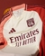 Camisa branca do Olympique Lyonnais, modelo III da Adidas, temporada 2024/2025, com detalhes em rosa e logo da Emirates.