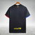 Camisa polo preta do Barcelona 23/24, com detalhes em azul e vermelho, e logotipo da Nike e Spotify.