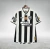 Camisa do Botafogo, modelo Home 24/25, nas cores preta e branca, com detalhes do patrocinador Parimatch.