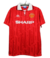 Camisa retrô masculina do Manchester United, modelo 92/94, na cor vermelha com detalhes em branco e o logotipo da Umbro.