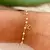PULSEIRA INFANTIL DE PEROLAS E PATINHA