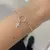 Pulseira Círculo Vazado e Cruz em Prata