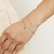 Pulseira banhada a ouro 18k com zircônia pendurada (55176806) na internet