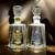 Botellas de mezcal Gran Valle, una de Maguey Cuishe y otra de Maguey Espadín, sobre un fondo suave.