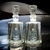 Botellas de Mezcal Espadín Joven y Mezcal Premium Espadín de Gran Valle, colocadas sobre una superficie oscura.
