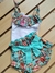 "Conjunto Super Fofo: Regata babado e Calcinha Tapa Fralda azul claro e flores– Conforto e Estilo para o Bebê!"