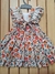 "Vestido Florido com Fundo ocre 3D, Maxi Laço nas Costas e Ombro Babado: Elegância e Estilo Floral em Cada Detalhe!" - comprar online