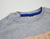 Remera gris con braille salmón - comprar online