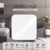 A imagem mostra um hub Zigbee da marca NovaDigital, um dispositivo central para sistemas de automação residencial.

Descrição Detalhada:

Aparelho: O hub possui um formato quadrado e compacto, com cantos arredondados. A cor predominante é branca, com deta