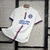 Camisa branca do Bahia 24/25 com detalhes em azul e vermelho, exibindo o logo do clube e a inscrição 'esportes da Sorte'.