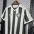 Camisa do Botafogo 24/25, com listras verticais em preto e branco, logo do clube e detalhes em tecido Reebok.