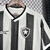 Camisa do Botafogo com listras verticais em preto e branco e escudo do time.