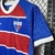 Camisa do Fortaleza 24/25, manto 1, com detalhes em azul, vermelho e logo do time.