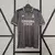 Camisa do Real Madrid 24/25 manto 3 na cor cinza, com detalhes em preto e logo da equipe.