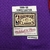 Etiqueta do jersey roxo da NBA, mostrando "1999-00 VINCE CARTER" e o logotipo "HARDWOOD CLASSICS" da Mitchell & Ness.
