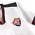 Camisa branca do time Vitória com detalhes em preto e vermelho, apresentando o escudo do clube e uma estrela acima do logo.
