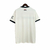 Camisa do Manchester United 24/25, vista traseira, em branco com detalhes escuros.