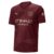 Camisa do Manchester City 24/25, manto 3, na cor bordô com detalhes em dourado.