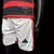 Uniforme infantil do Flamengo, composto por camiseta preta e vermelha com detalhes em branco e calções brancos com logotipo da Adidas.