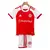 Kit infantil do Internacional 24/25, composto por camisa vermelha e branca com logotipo do time e calções brancos.