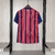 Camisa do Bahia puma torcedor Tricolor 25/26 com listras verticais vermelhas e azuis e logo do clube no peito.