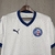 Camisa branca do Bahia torcedor 2025/2026 com gola e punhos azuis, logo do clube e da Puma na frente, bahia terra mãe.
