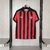 Camisa do Vitória volt Manto 1 temporada 2025/2026 com listras verticais vermelhas e pretas é uma linha branca, escudo bordado.