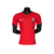 Camisa versão jogador da seleção de Portugal 24/25, na cor vermelha com detalhes em verde e logo da Nike.