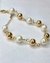 PULSEIRA PEROLA E ESFERA DOURADA na internet
