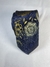 Gravata azul com estampas florais douradas