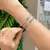 Bracelete Largo Trançado Banhado a Ródio Branco na internet