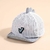GORRA PARA BEBÉ DINOSAURIO RAYAS - MaxxWorldShop