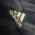 Jaqueta Corta-Vento Real Madrid II 23/24 - Masculina Adidas - Azul com listras pretas - Cadfer Sports