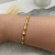 BRACELETE ONDULADO COM ZIRCÔNIAS - comprar online